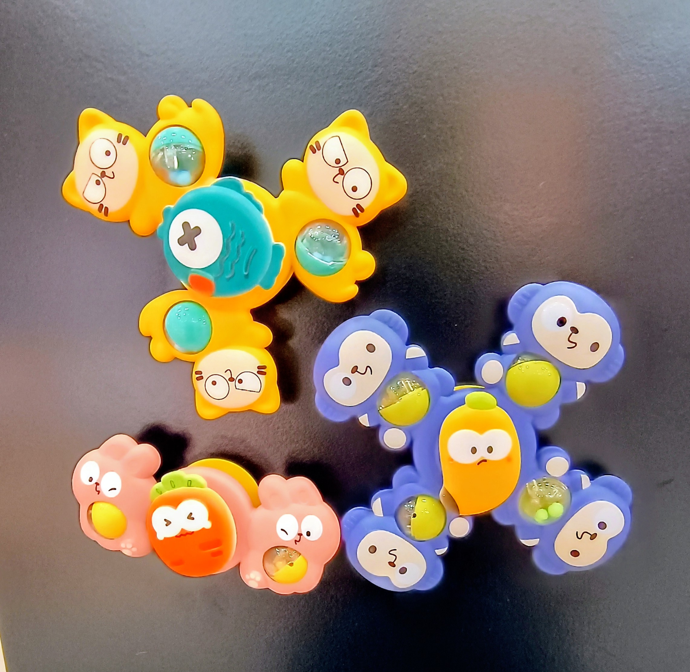 Colorful baby spinner toys with animal faces and suction base