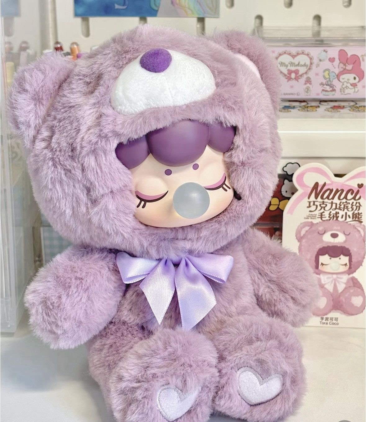 مجموعه عروسک‌های نانسی در رنگ‌های پاستلی صورتی، آبی، زرد، سبز و بنفش