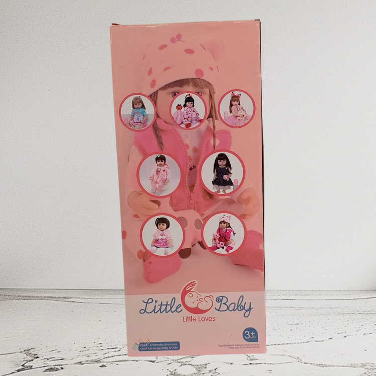 عروسک سیلیکونی Little Baby دختر با پیراهن صورتی و موی بلند